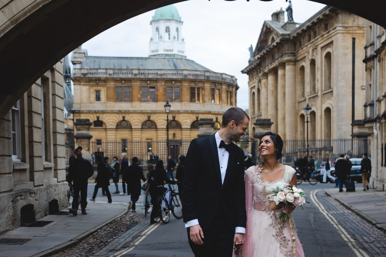 newly married couple in Oxford Bodleian Library Street