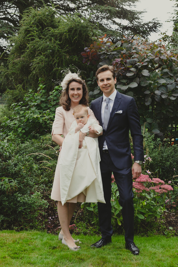 Happy newly wed couple outside Oxford Bodleian Library. Alternative confetti shot.
