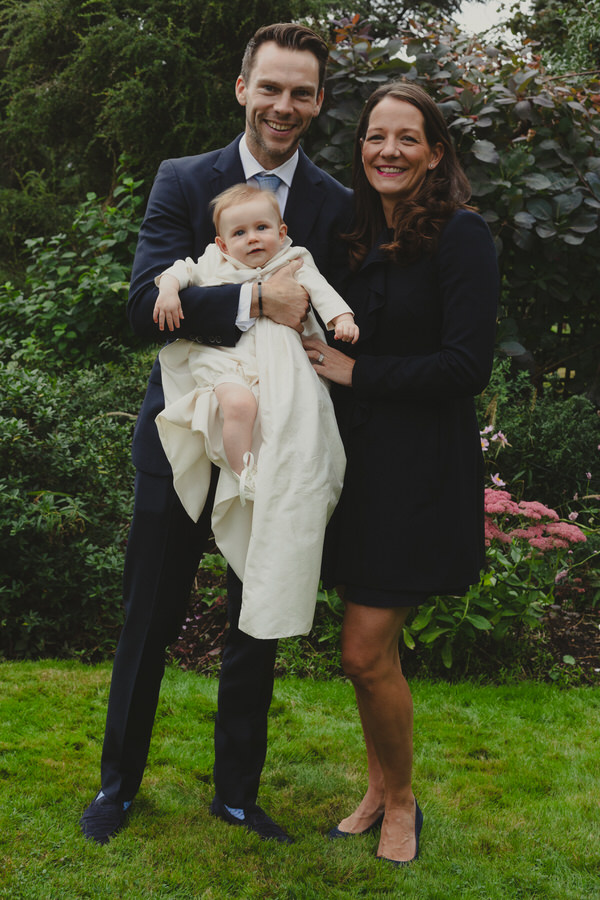Happy newly wed couple outside Oxford Bodleian Library. Alternative confetti shot.