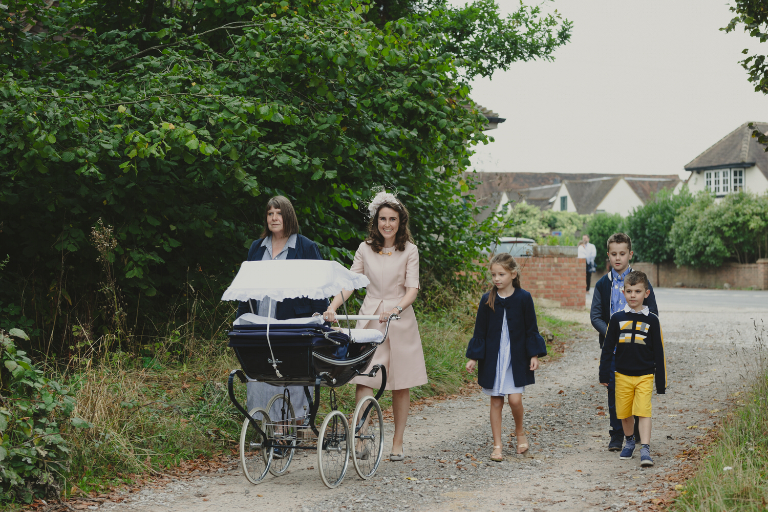Happy newly wed couple outside Oxford Bodleian Library. Alternative confetti shot.