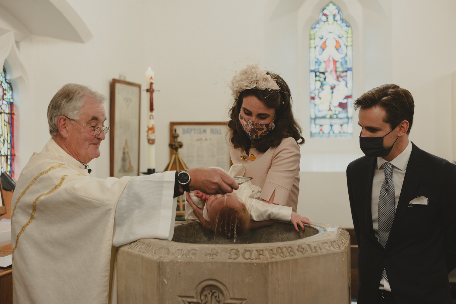 Happy newly wed couple outside Oxford Bodleian Library. Alternative confetti shot.