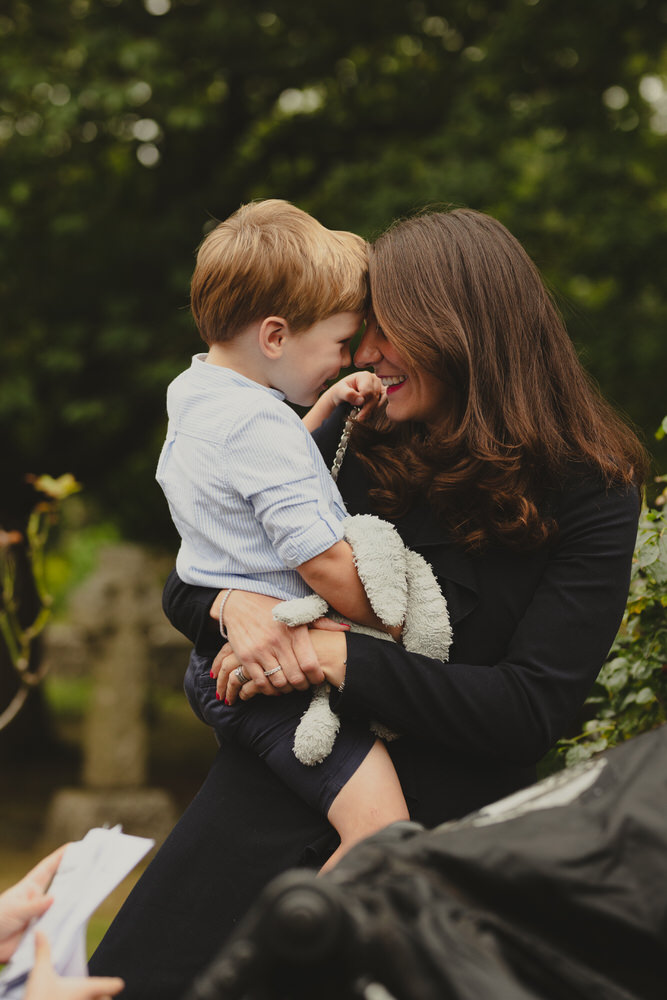 Happy newly wed couple outside Oxford Bodleian Library. Alternative confetti shot.