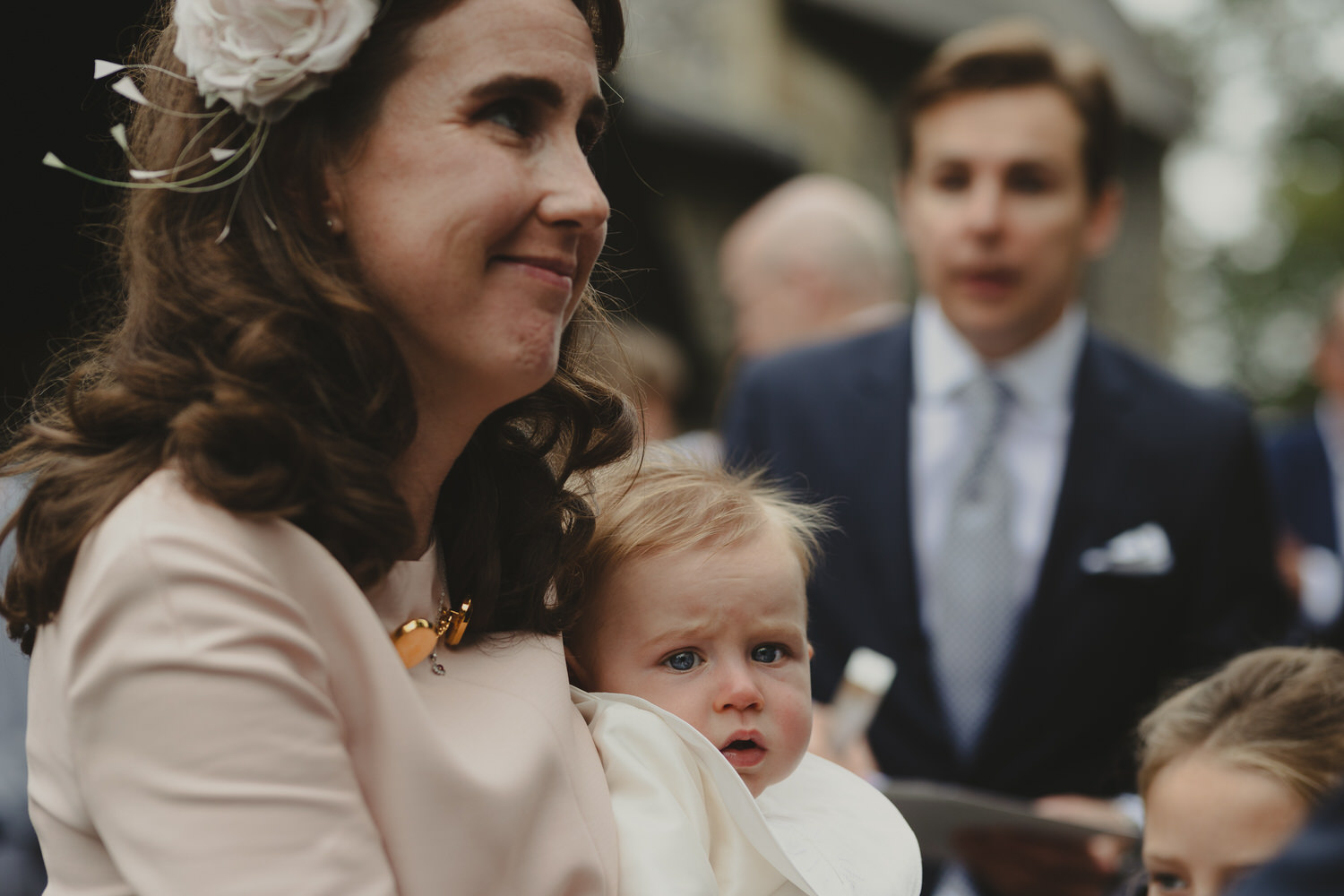 Happy newly wed couple outside Oxford Bodleian Library. Alternative confetti shot.