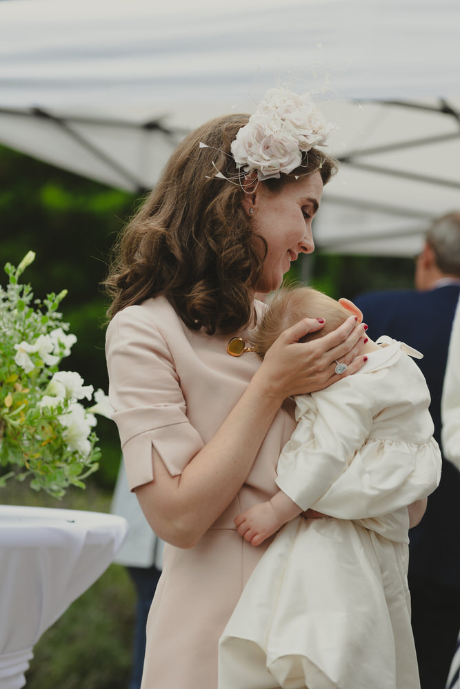 Happy newly wed couple outside Oxford Bodleian Library. Alternative confetti shot.