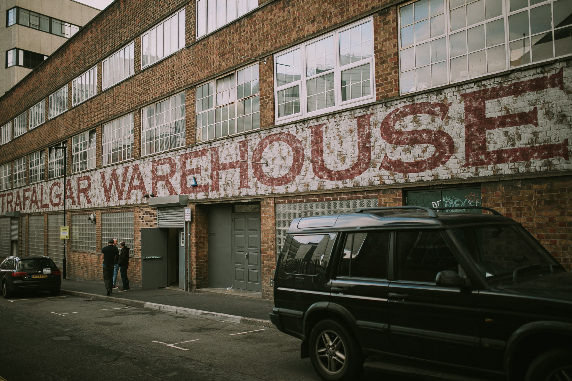 Outside Trafalgar Warehouse - events venue. Industrial Venue with rustic, big lettering on the frontage.