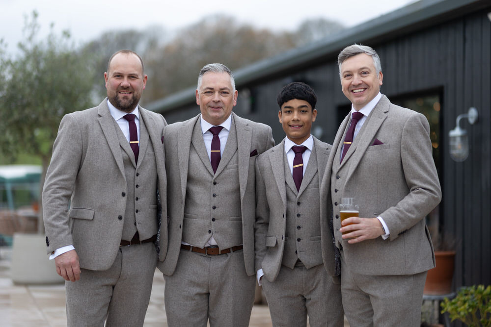 Happy newly wed couple outside Oxford Bodleian Library. Alternative confetti shot.