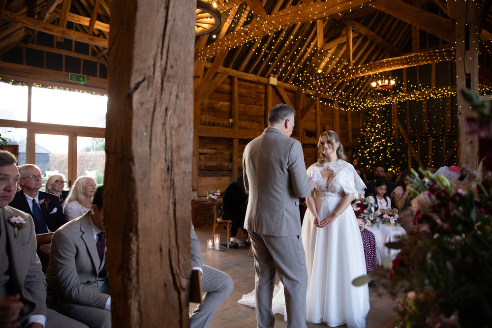 Groom and his groomsmen wearing funny glasses looking at the camera